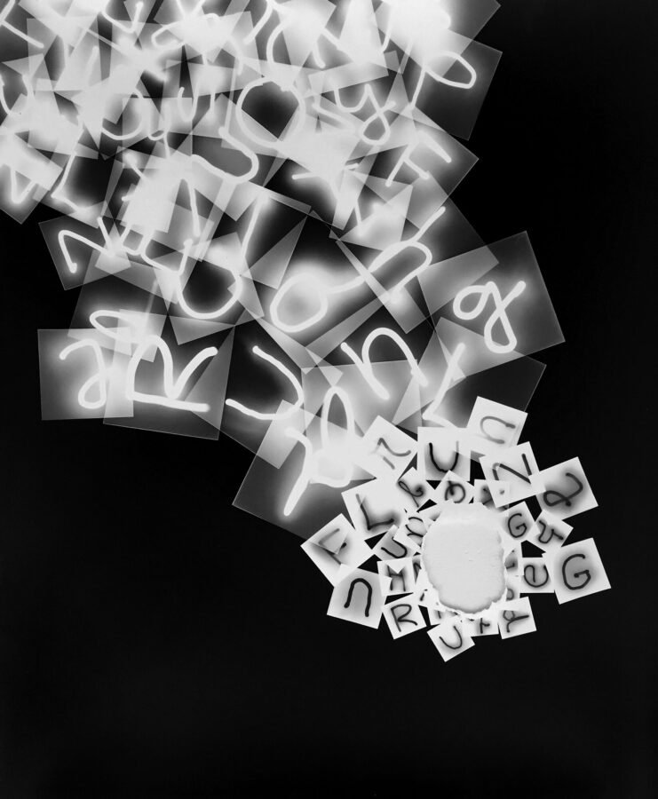 collaged photograms with letters overlaying each other in black and white